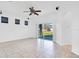 Living room with sliding glass doors leading to a patio and backyard at 14643 Tanja King Blvd, Orlando, FL 32828
