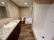 Bathroom boasts a shower, bathtub, and granite vanity at 16770 Sw 60Th Pl, Ocala, FL 34481