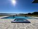 Inviting pool and spa area with lake views, perfect for relaxation at 17144 Phil C Peters Rd, Winter Garden, FL 34787
