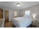 Bedroom with a white metal bed frame and en-suite bathroom at 2010 Overlook Dr, Winter Haven, FL 33884