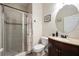 Bathroom with shower/tub combo, vanity, and a round mirror at 2338 Darlin Cir, Orlando, FL 32820