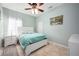 Bright bedroom with a queen-size bed, nightstand, and ceiling fan at 2338 Darlin Cir, Orlando, FL 32820