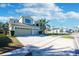 Two-story house with three car garage and landscaped yard at 2338 Darlin Cir, Orlando, FL 32820