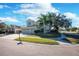 Two-story house with three car garage and landscaped yard at 2338 Darlin Cir, Orlando, FL 32820