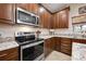 Kitchen with stainless steel stove and microwave at 2338 Darlin Cir, Orlando, FL 32820