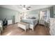 Main bedroom with white furniture and wood flooring at 2338 Darlin Cir, Orlando, FL 32820