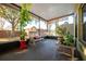 Relaxing screened porch with seating and potted plants at 2338 Darlin Cir, Orlando, FL 32820