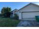 Tan house with a two-car garage and a spacious front yard at 3481 Cornell Ter, Deltona, FL 32738