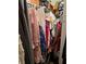 Full-length closet with clothes on hanging racks at 3752 Southpointe Dr # 5, Orlando, FL 32822