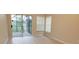 Spacious bedroom with sliding glass doors to patio at 3772 Ventura Cove Dr, Orlando, FL 32822