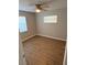 Bright bedroom with wood-look floors and ceiling fan at 451 Lowndes Sq, Casselberry, FL 32707