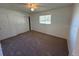 Simple bedroom with carpet and neutral walls at 4518 Watch Hill Rd, Orlando, FL 32808