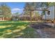 Backyard view of home with playset and grassy area at 595 Preston Rd, Longwood, FL 32750