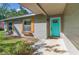 Welcoming front entrance with teal door and wood accents at 595 Preston Rd, Longwood, FL 32750