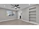 Living room with built-in shelving and wood-look floors at 616 Ellsworth St, Altamonte Springs, FL 32701