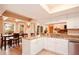 Spacious kitchen featuring granite countertops and white cabinets at 6850 Spring Rain Dr, Orlando, FL 32819