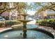 Scenic town square with a fountain, benches, and shops at 1109 Banks Rose Ct, Celebration, FL 34747