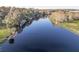 Tranquil waterfront view with boats docked along the riverbank at 1043 Lemon Bluff Rd, Osteen, FL 32764