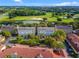 Community overview showcasing townhouses near a golf course at 1054 Waterside Dr, Celebration, FL 34747