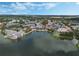 Wide aerial view of a lakeside town with shops and residences at 1054 Waterside Dr, Celebration, FL 34747