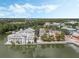 Aerial view of waterfront property with buildings and a calm lake at 1054 Waterside Dr, Celebration, FL 34747