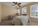 Cozy bedroom with two twin beds and large windows at 1054 Waterside Dr, Celebration, FL 34747