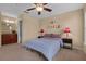 Spacious bedroom with a queen bed and lots of natural light at 1054 Waterside Dr, Celebration, FL 34747