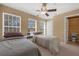Two twin beds in a well-lit bedroom with access to a bathroom at 1054 Waterside Dr, Celebration, FL 34747