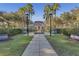 Community center with a tranquil fountain and manicured landscaping at 1054 Waterside Dr, Celebration, FL 34747
