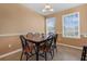 Charming dining area with a wooden table and six chairs at 1054 Waterside Dr, Celebration, FL 34747