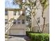 Exterior view of the property, showing a garage and landscaping at 1054 Waterside Dr, Celebration, FL 34747