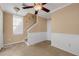 Bright foyer with staircase, window and wainscoting at 1054 Waterside Dr, Celebration, FL 34747
