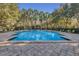 Resort-style community pool with lounge chairs and palm trees at 1054 Waterside Dr, Celebration, FL 34747