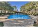 Inviting community pool surrounded by lush landscaping at 1054 Waterside Dr, Celebration, FL 34747