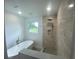 Updated bathroom with soaking tub and walk-in shower at 1115 Munster Ct, Kissimmee, FL 34759