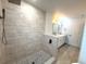 Clean bathroom with walk-in shower and updated fixtures at 1115 Munster Ct, Kissimmee, FL 34759