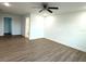 Main bedroom with ceiling fan, ensuite bathroom access, and large closet at 1115 Munster Ct, Kissimmee, FL 34759