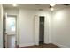 Bright bedroom with wood-look floors and a double-door closet at 1115 Munster Ct, Kissimmee, FL 34759