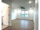 Large bedroom with ceiling fan, window, and laminate flooring at 1115 Munster Ct, Kissimmee, FL 34759
