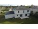 Two-story house rear view, gray siding, sliding doors to patio at 1115 Munster Ct, Kissimmee, FL 34759