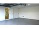 Spacious garage with epoxy flooring and access to the house at 1115 Munster Ct, Kissimmee, FL 34759