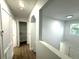 Clean hallway with ample storage and linen closet at 1115 Munster Ct, Kissimmee, FL 34759