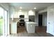 Modern kitchen with stainless steel appliances and island at 1115 Munster Ct, Kissimmee, FL 34759