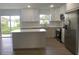 Modern kitchen with island and stainless steel appliances at 1115 Munster Ct, Kissimmee, FL 34759