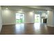 Open living area with hardwood floors and access to backyard at 1115 Munster Ct, Kissimmee, FL 34759