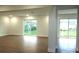 Spacious living area with hardwood floors and multiple exits at 1115 Munster Ct, Kissimmee, FL 34759