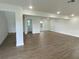 Spacious living area with laminate wood flooring and an open floor plan at 1115 Munster Ct, Kissimmee, FL 34759