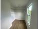 Bright walk-in closet with ample shelving and window at 1115 Munster Ct, Kissimmee, FL 34759