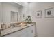 Double vanity bathroom with granite countertop and white cabinets at 1778 Three Bars Rd, Kissimmee, FL 34744