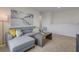Bright bonus room features a comfortable sectional sofa and large wall art at 1778 Three Bars Rd, Kissimmee, FL 34744